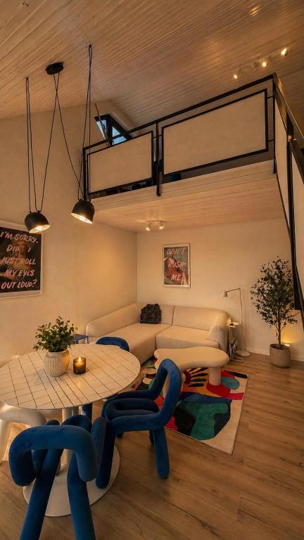 a living room with a table and a couch at Maisonette Wohnung WALDLOFT in Mehlmeisel