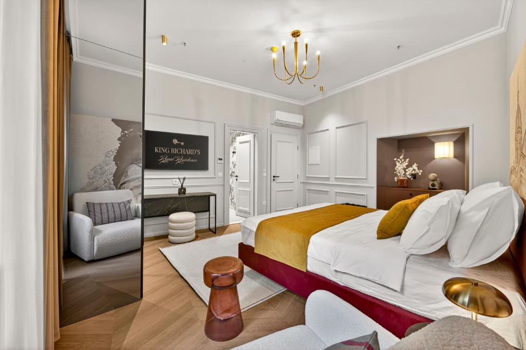 a bedroom with a king sized bed and a living room at King Richards Royal Residence in Dubrovnik
