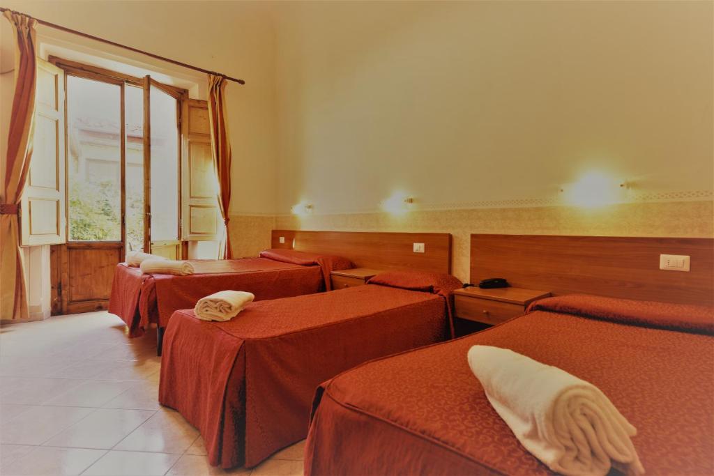 Postel nebo postele na pokoji v ubytování Hotel Palazzuolo