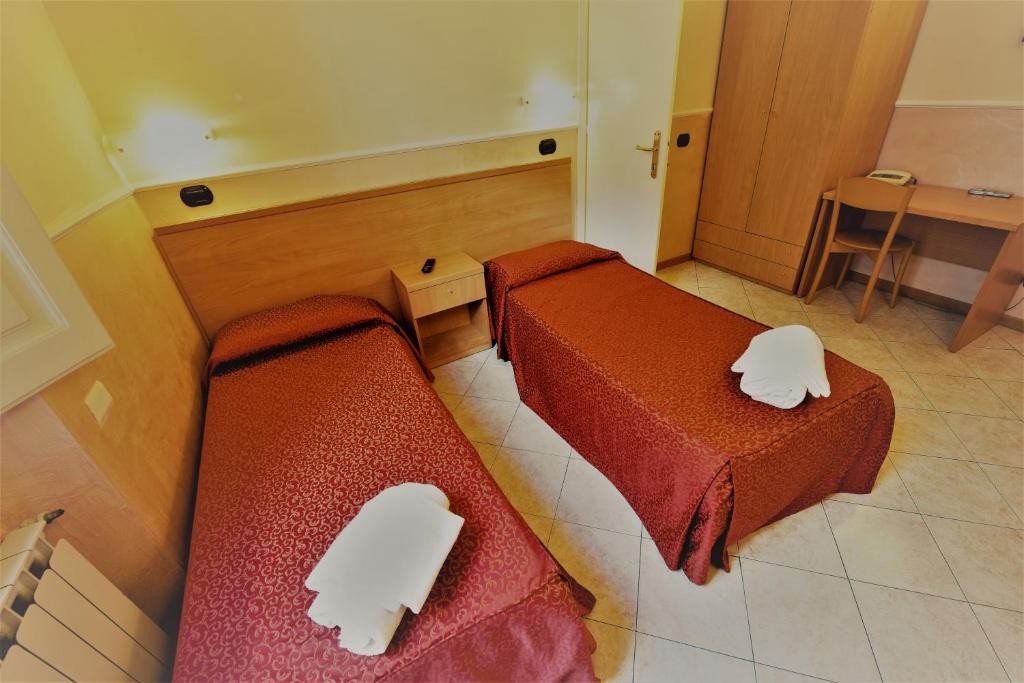 Postel nebo postele na pokoji v ubytování Hotel Palazzuolo