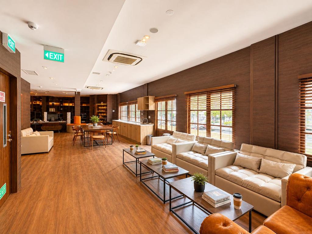 a large living room with couches and tables at Bugis Social-Newly Renovated in Singapore