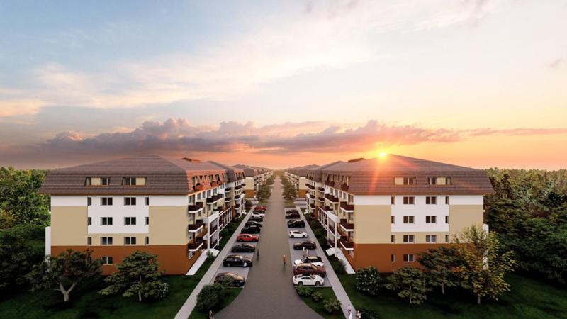 an aerial view of a parking lot in front of buildings at Nico's Place in Sînpetru