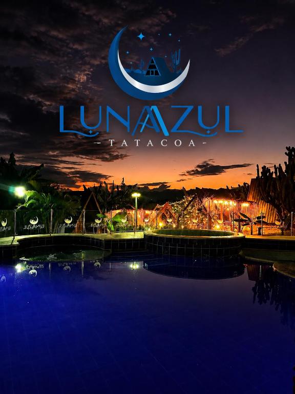 a sign that reads luna tarapa at night at Hotel Luna Azul Tatacoa in Villavieja