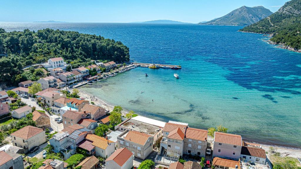 an aerial view of a beach with houses and the ocean at Villa Estera by Villas Guide in Ston