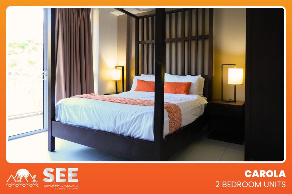 a bedroom with a bed with orange pillows and a window at PICO DE LORO Pool Accessible CAROLA 2 Bedroom Units by SEE Condominiums in Nasugbu