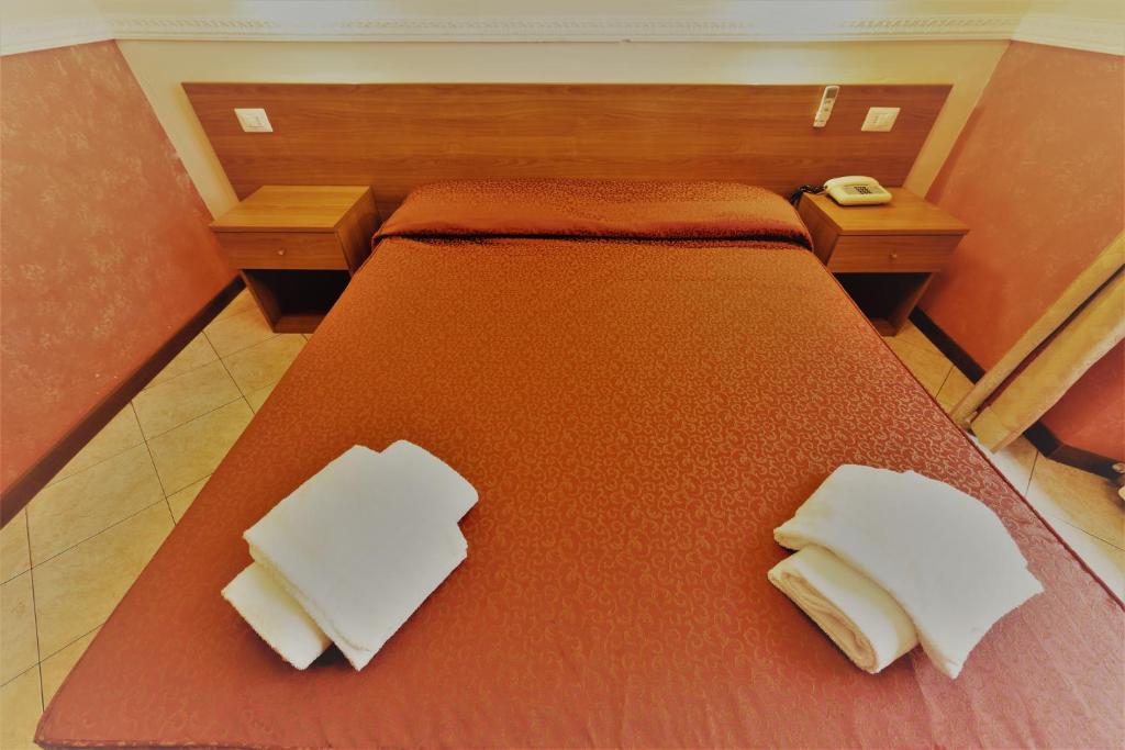 Postel nebo postele na pokoji v ubytování Hotel Palazzuolo