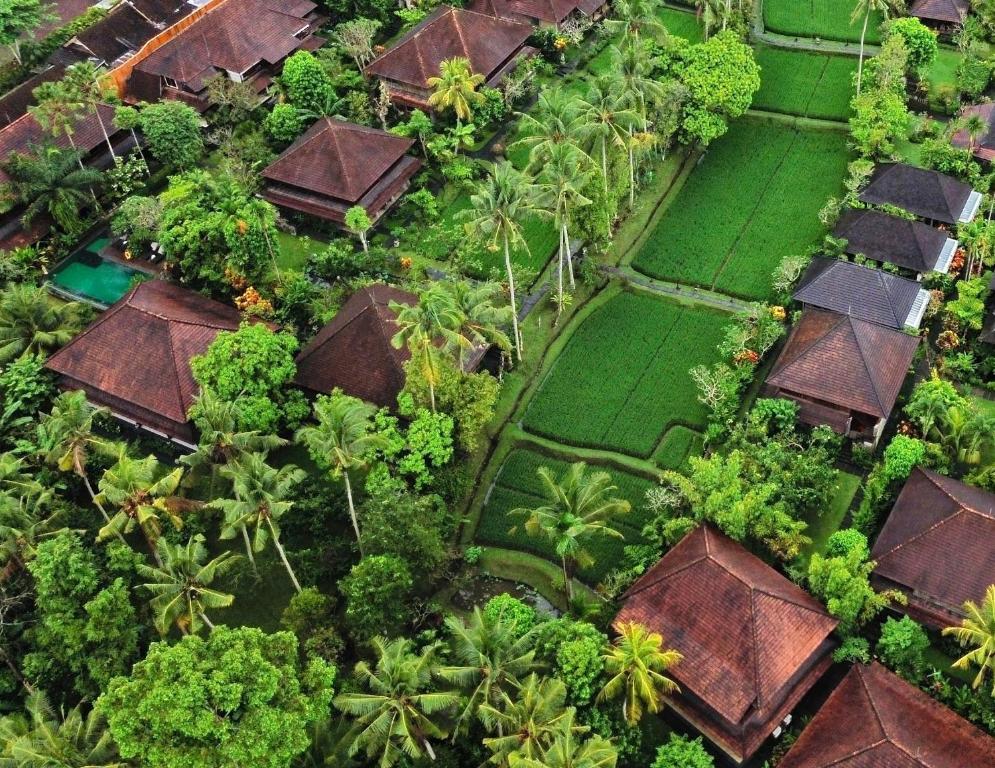 an aerial view of a resort with trees and grass at Ananda Ubud Resort in Ubud