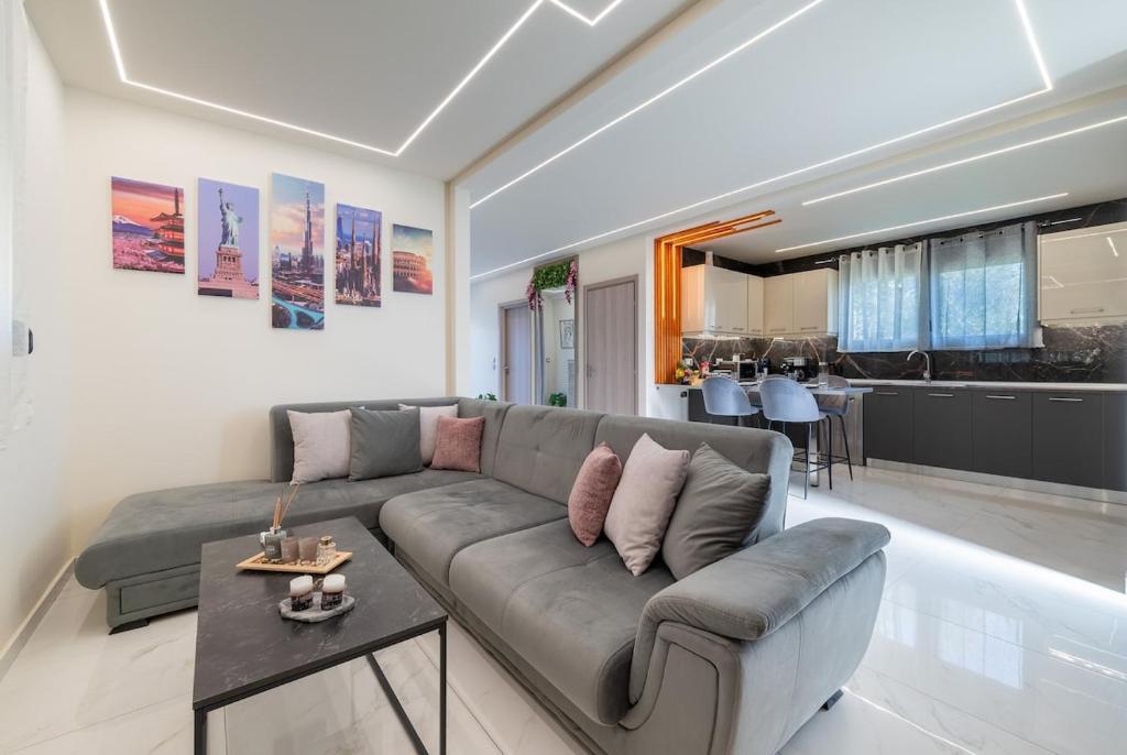 a living room with a couch and a table at Angel House in Ialysos