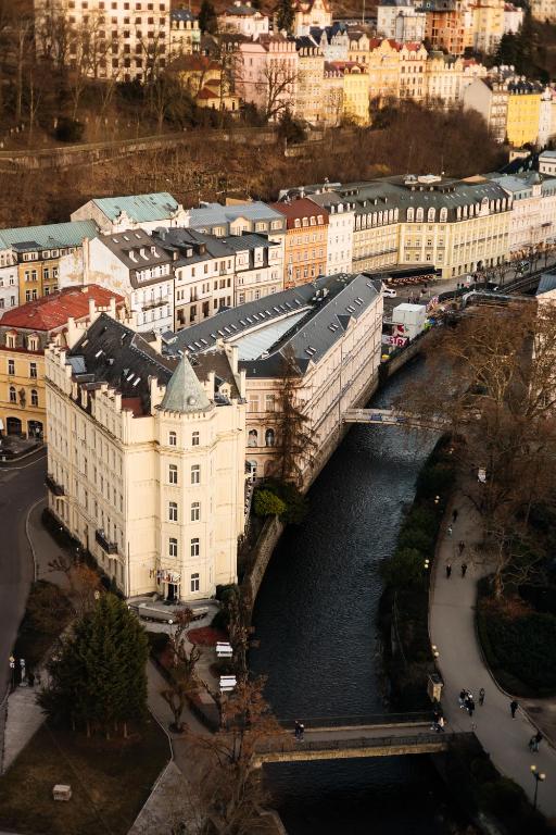 an aerial view of a city with a river and buildings at Hotel Pavlov in Karlovy Vary