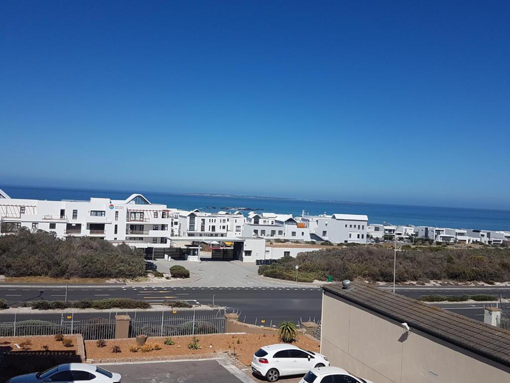 a view of a parking lot next to the ocean at Sea Gem in Big Bay