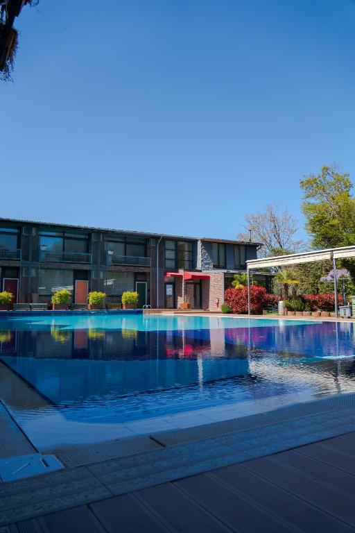 a swimming pool in front of a building at Green House Garden Park Hotel in Istanbul