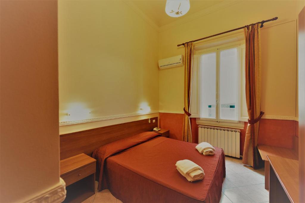 Postel nebo postele na pokoji v ubytování Hotel Palazzuolo