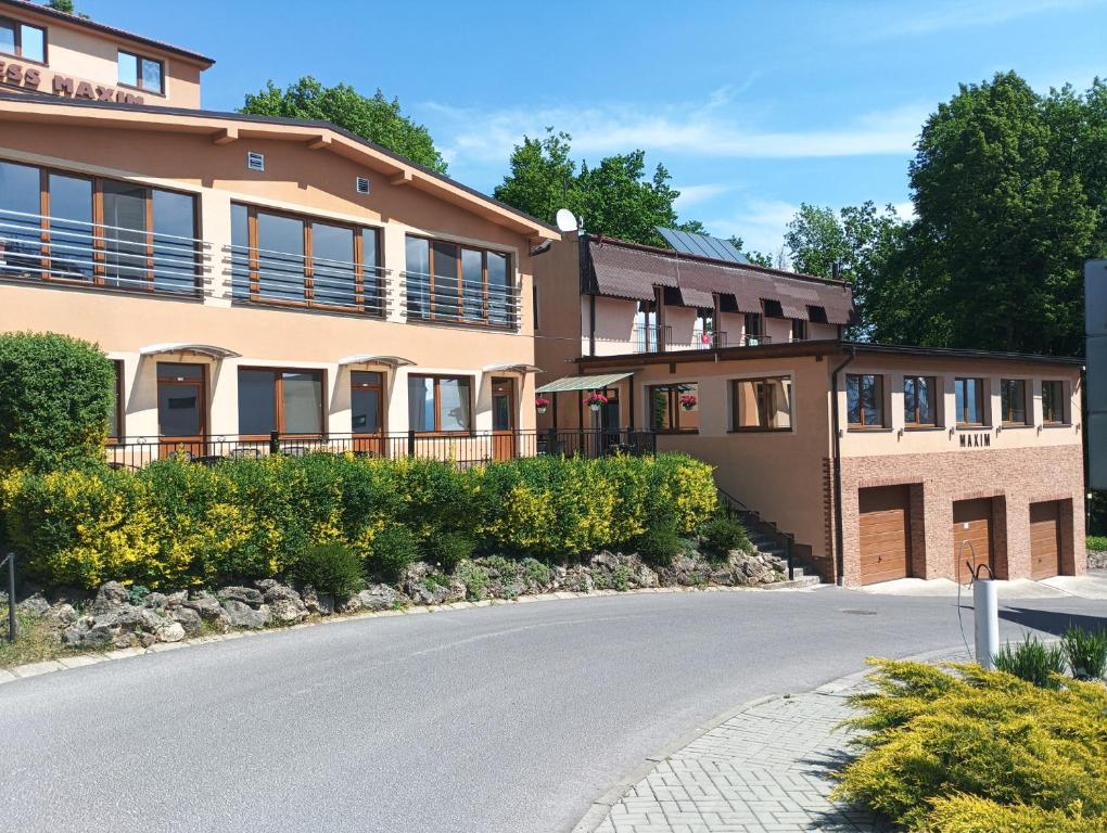 a building with a road in front of it at Wellness rezort Maxim Bojnice in Bojnice