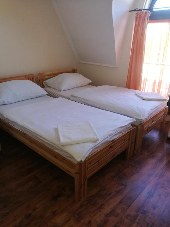Postel nebo postele na pokoji v ubytování Mátyás Szállás