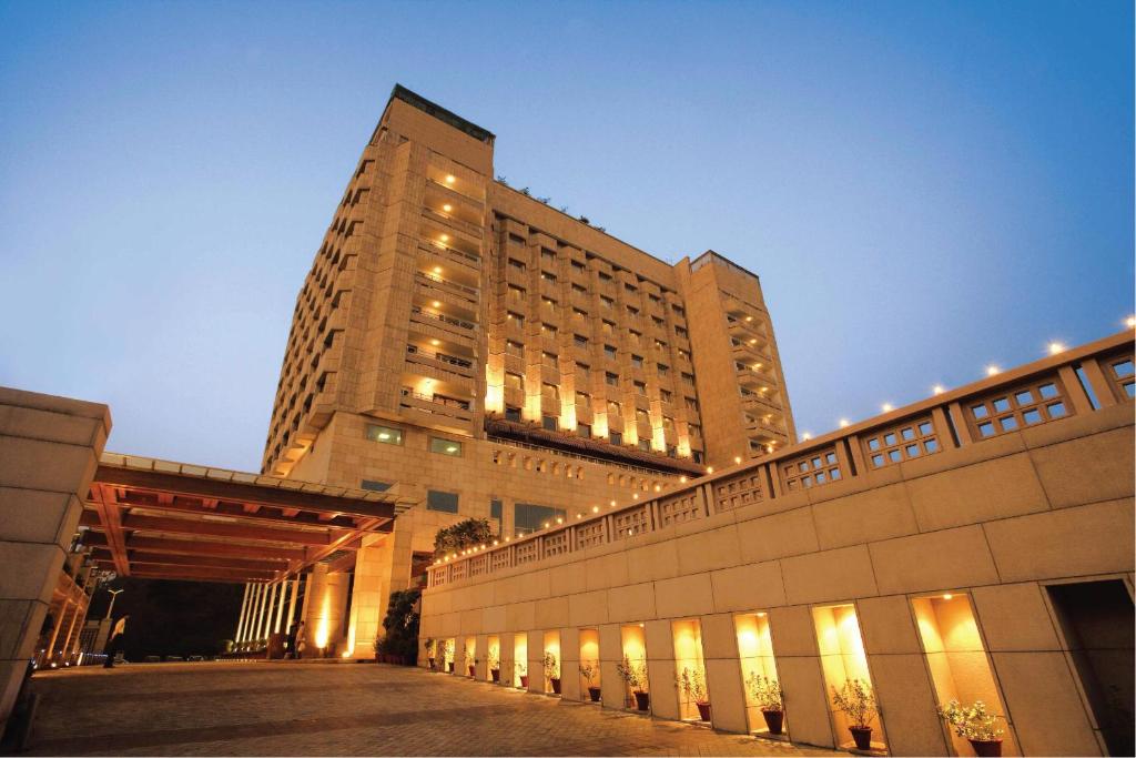 a tall building with a bridge in front of it at Jaypee Vasant Continental in New Delhi