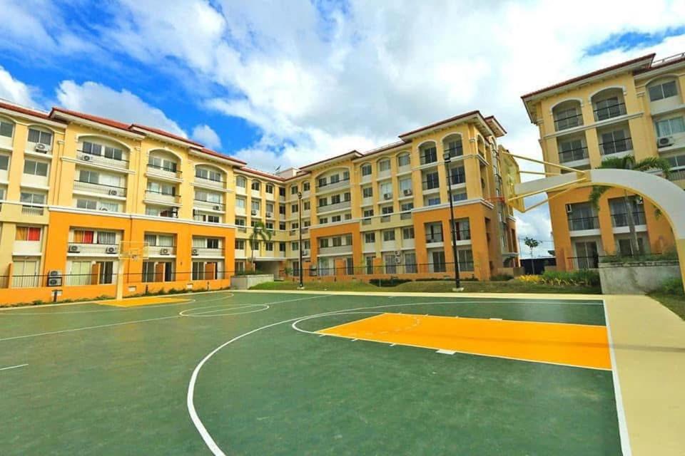 an empty basketball court in front of a building at Cebu's Affordable Condo Rentals in Cebu City
