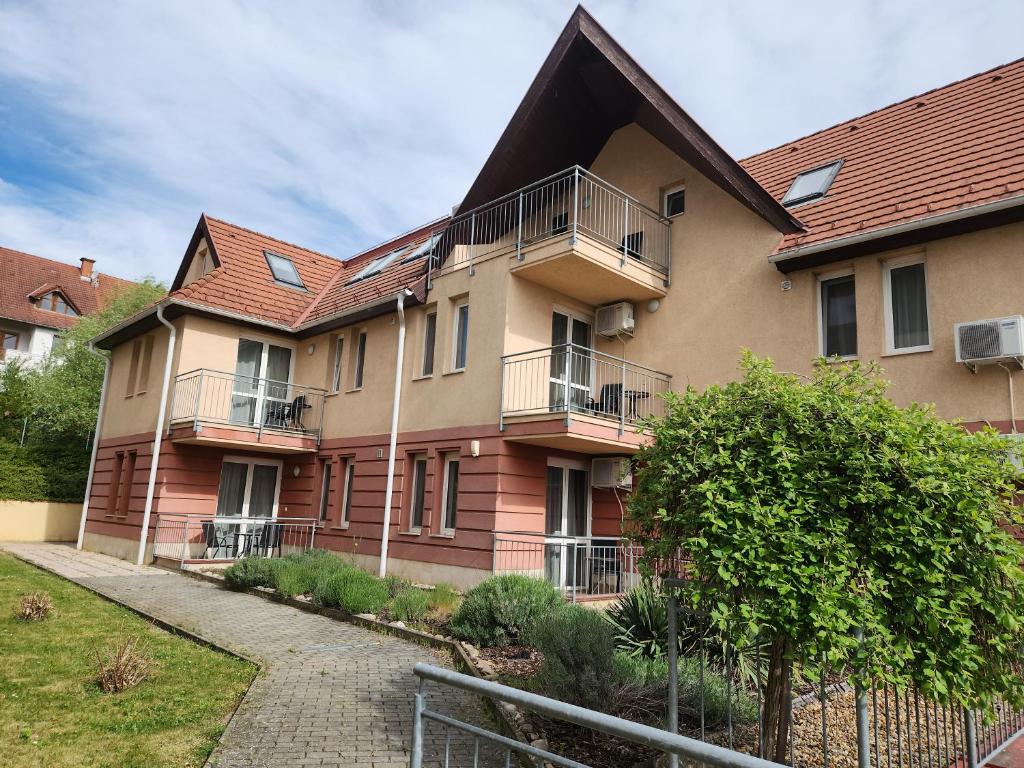 a building with balconies on the side of it at Fortuna 7 in Hévíz