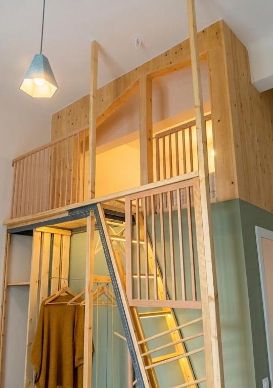 a loft bed in a house under construction at Orchard in Athens