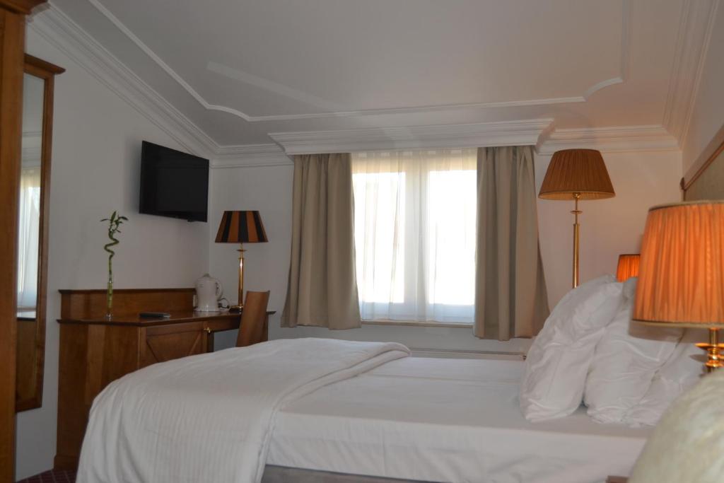 Postel nebo postele na pokoji v ubytování Hotel The Lord