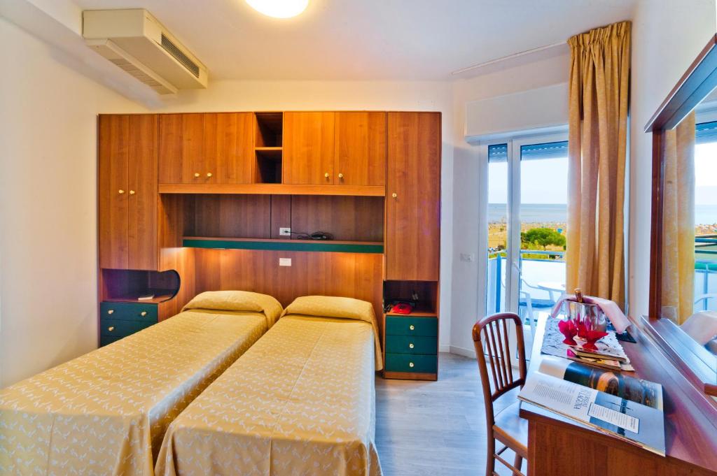 A bed or beds in a room at Hotel Gimm