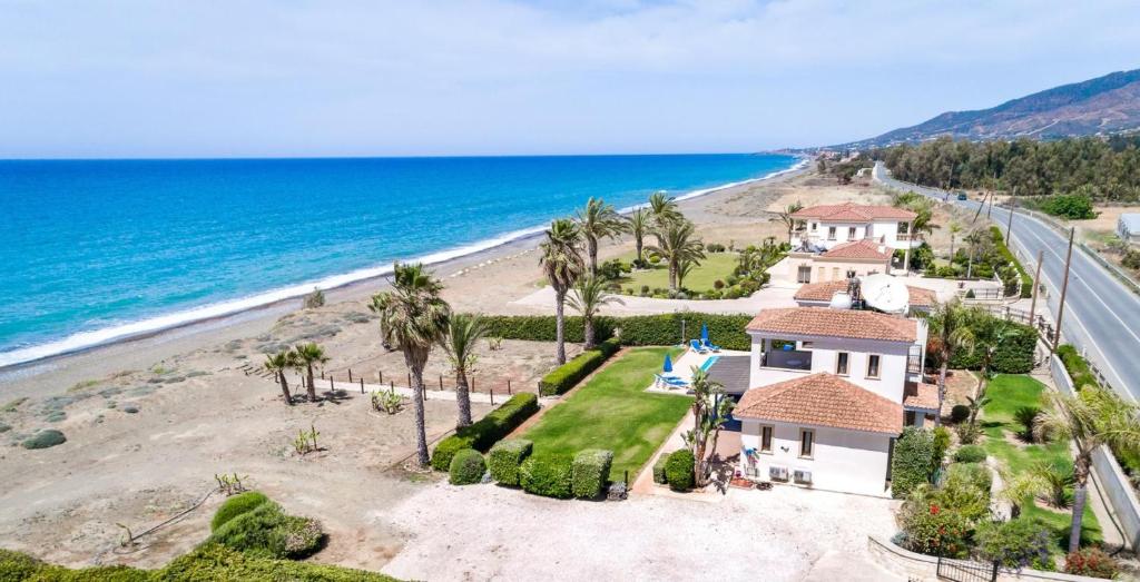 an aerial view of a house on the beach at Seafront Villa Ocean Pearl - Private Beach Area & Pool in Polis Chrysochous