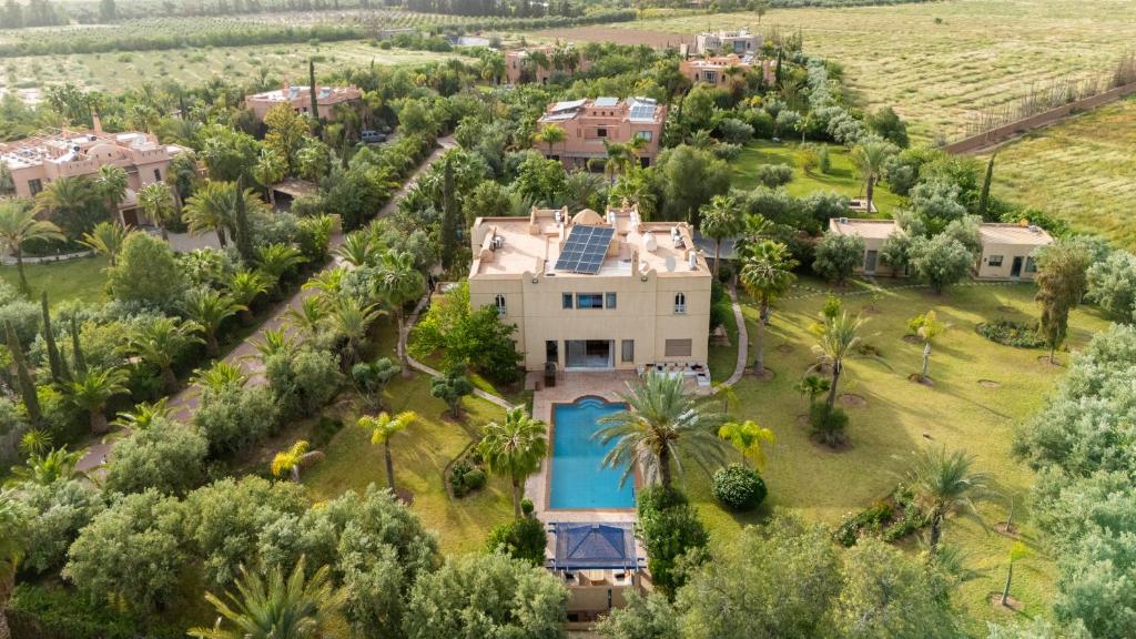 an aerial view of a house with a swimming pool at Villa Aurea Marrakech in Gzoula
