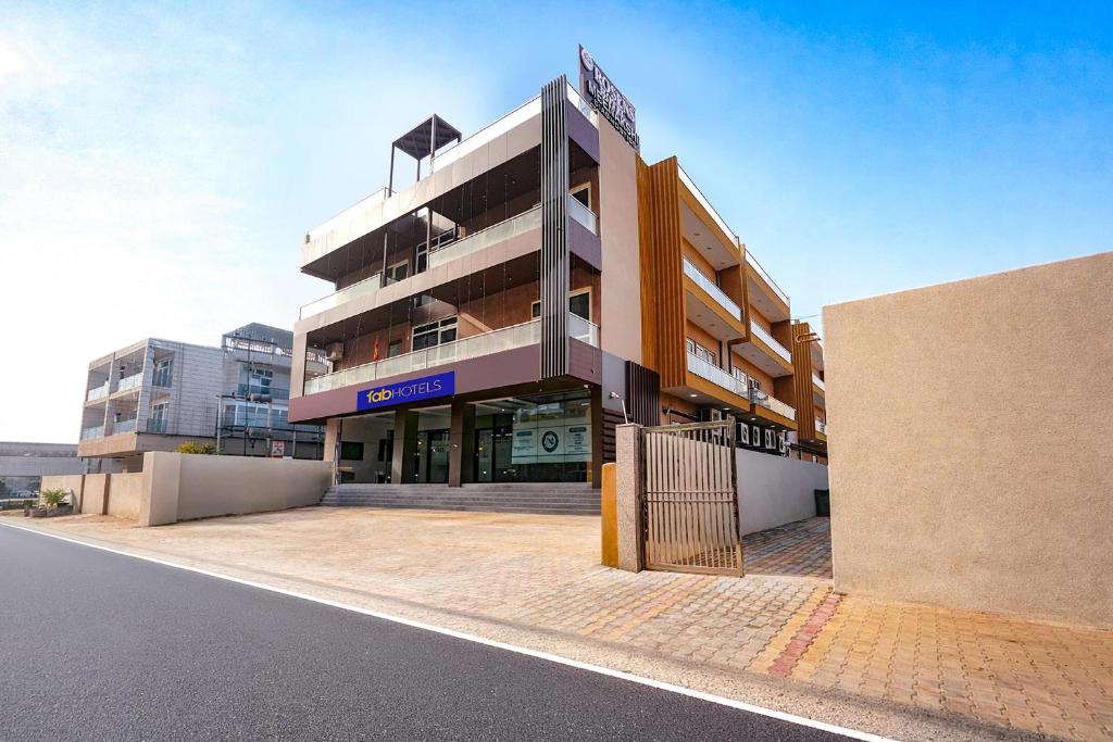 a building with a gate in front of it at FabHotel Prime Rosens in Māripat