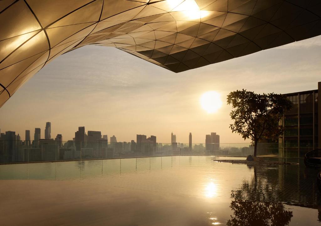 a view of the city from the rooftop of a building at Waldorf Astoria Bangkok in Bangkok