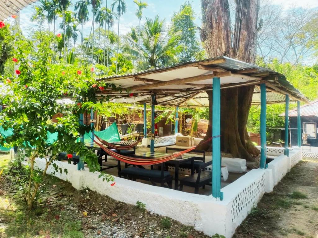 a hammock in a gazebo in a garden at The Blue Planet Long Island in Middle Andaman