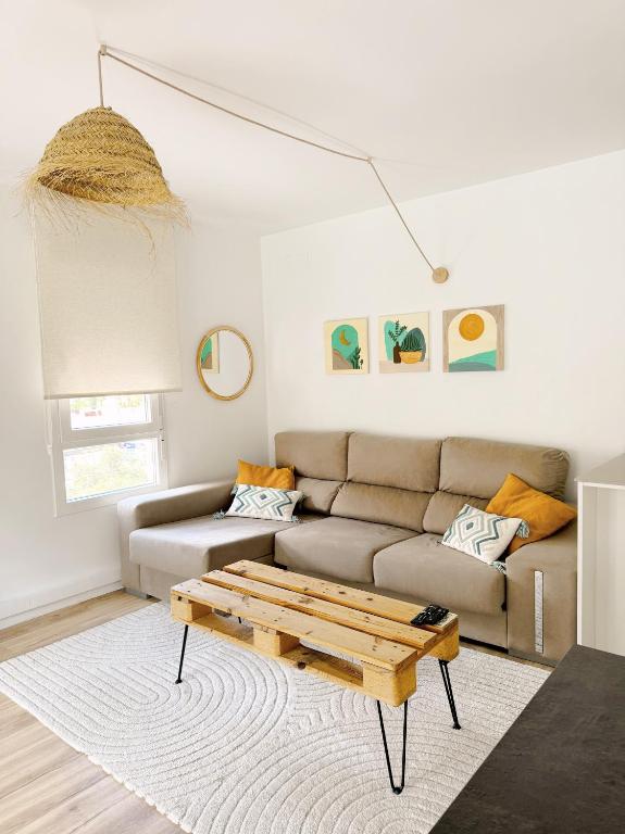 a living room with a couch and a coffee table at Almar Albir in Albir