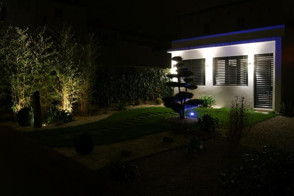 a house at night with lights in the yard at Studio Royan in Royan