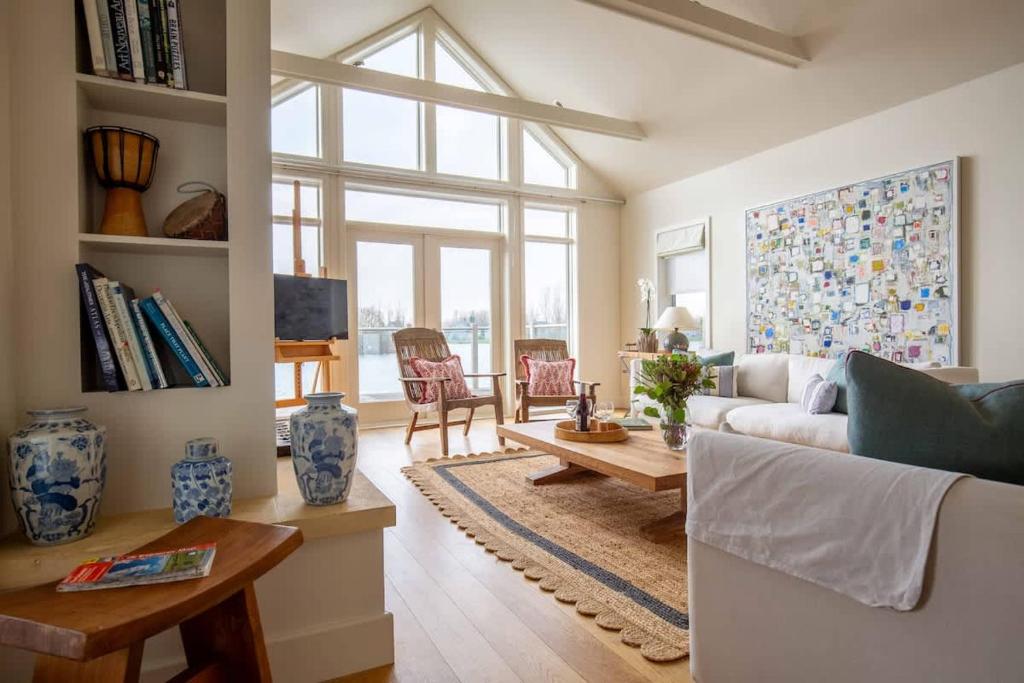 a living room with a couch and a table at Summer Lake in South Cerney