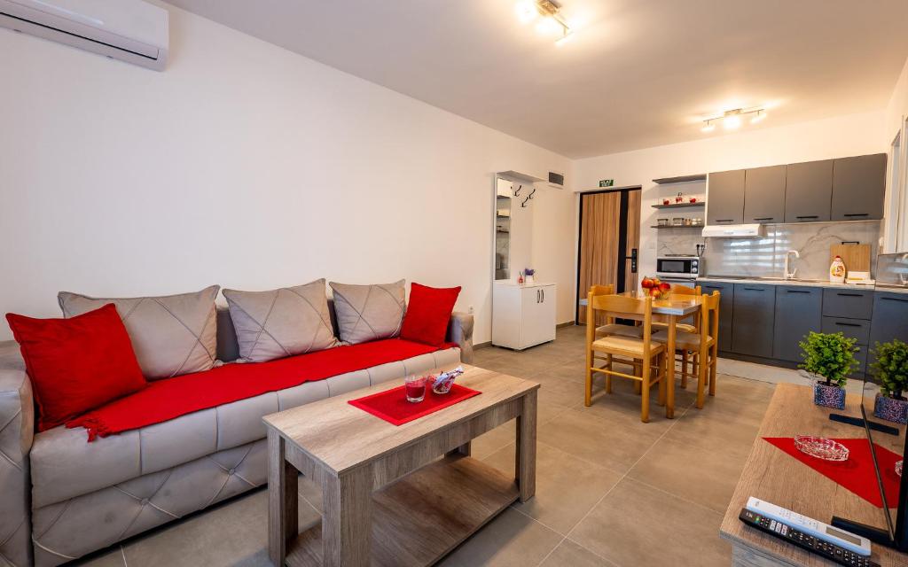 a living room with a couch and a table at Silver Sunset 26 in Veliko Gradište