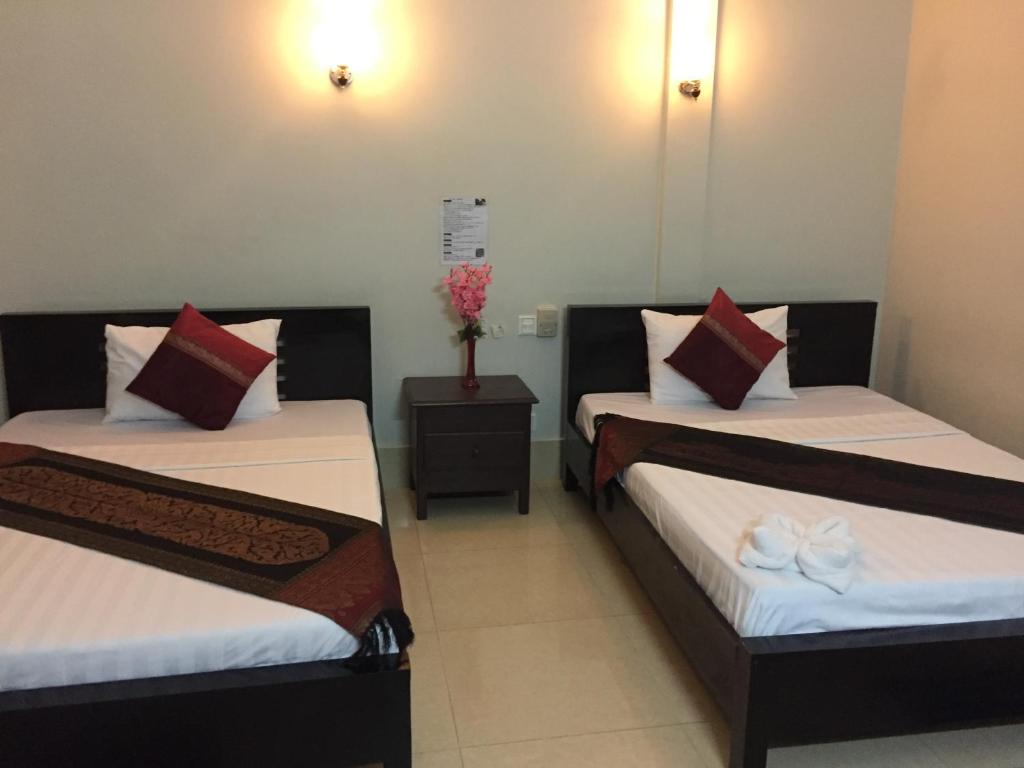 Postel nebo postele na pokoji v ubytování IKI IKI Guesthouse