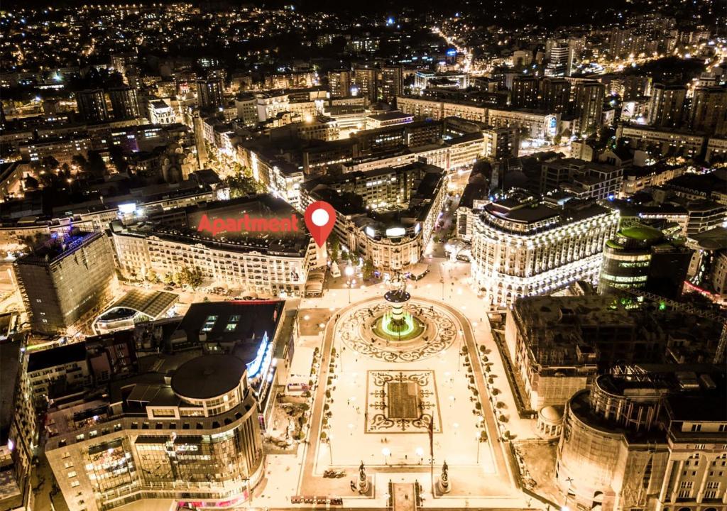 an aerial view of a city at night at Ira's Square 2 Bedroom Free Parking in Skopje