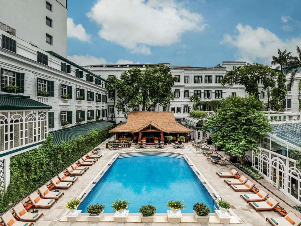 an overhead view of a swimming pool at a hotel at Sofitel Legend Metropole Hanoi in Hanoi