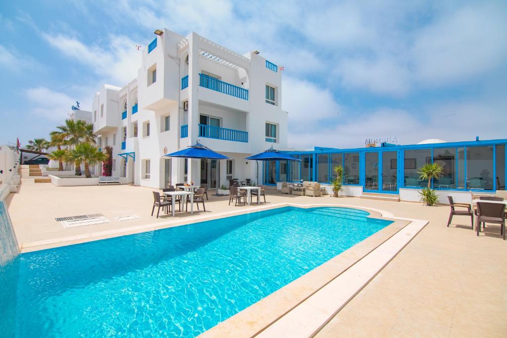 an image of a villa with a swimming pool at Pallax hotel in Zarzis