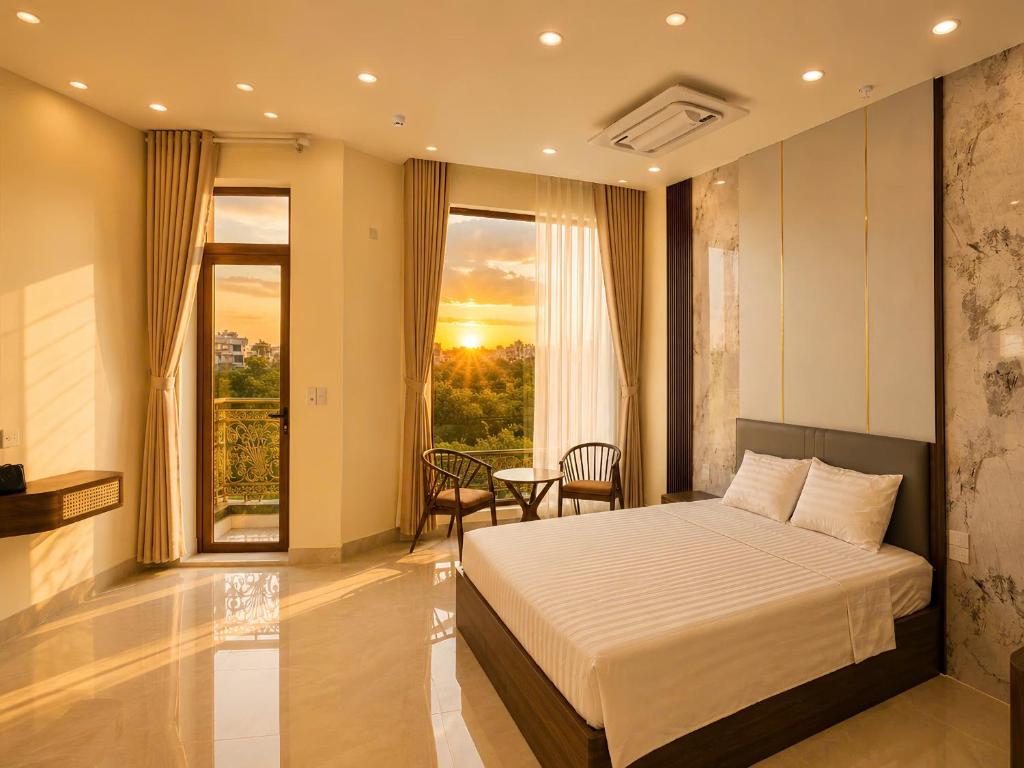 a bedroom with a bed and a large window at O Lily Hotel in Ninh Binh