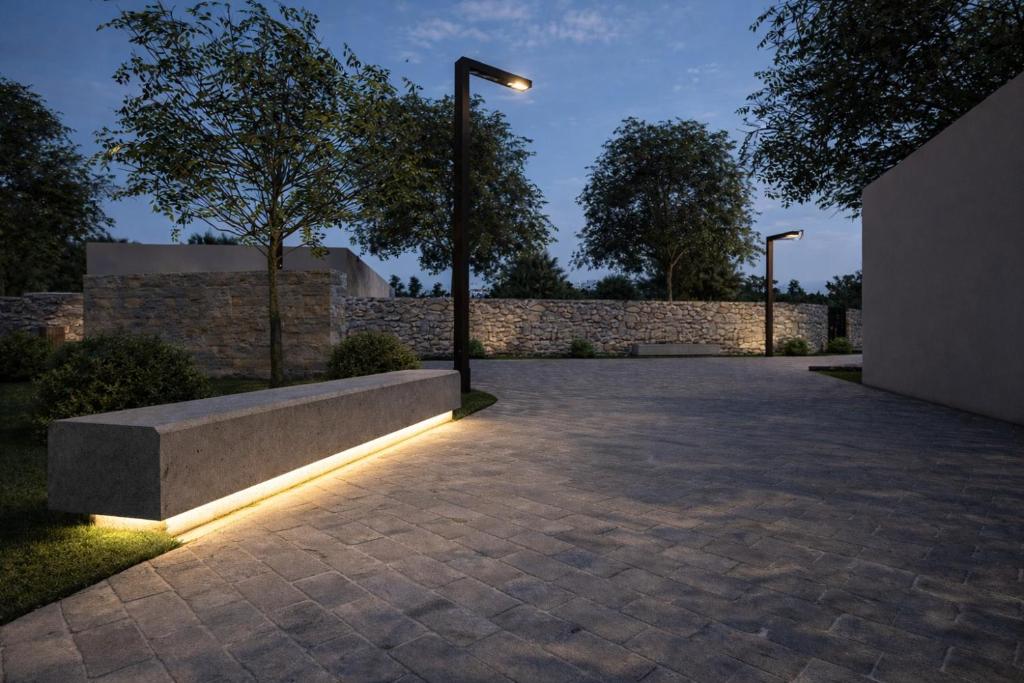 a park with a bench and a street light at Carpe Diem Hotel in Borsh