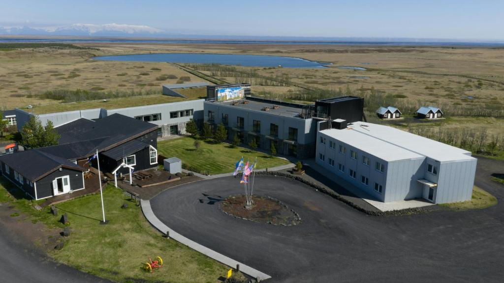 an overhead view of a building with a road in front at Efri-Vík Bungalows in Kirkjubæjarklaustur