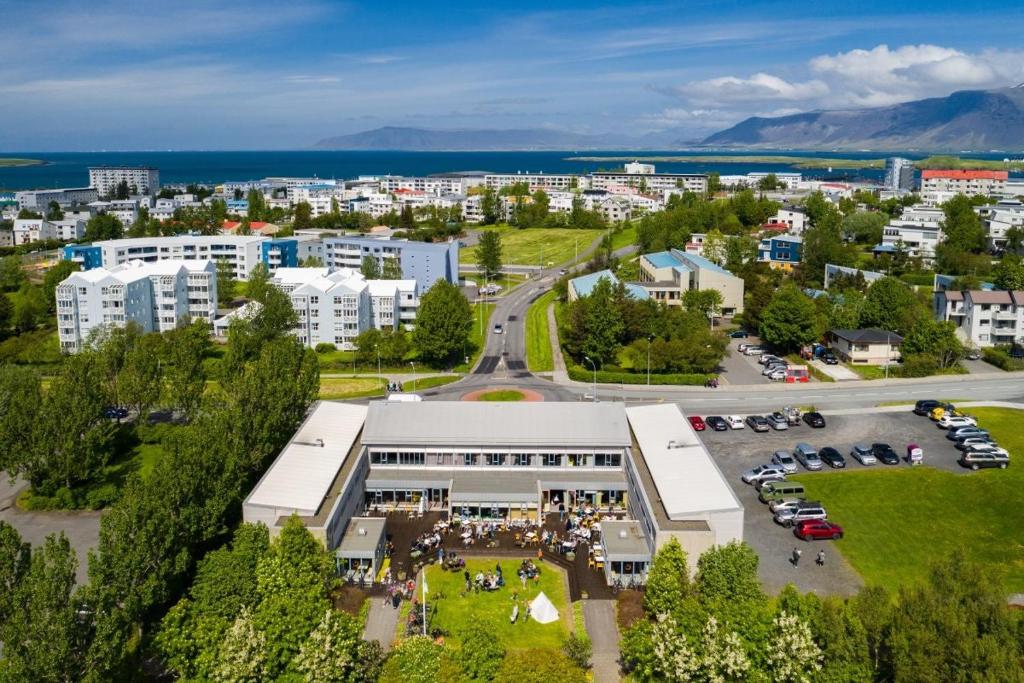 an aerial view of a building with a parking lot at Dalur - HI Eco Hostel in Reykjavík