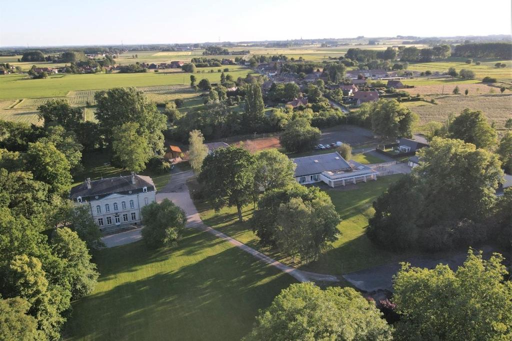 an aerial view of a large white house with trees at Domaine du Béron - Chateau et gites in Cappelle-en-Pévèle