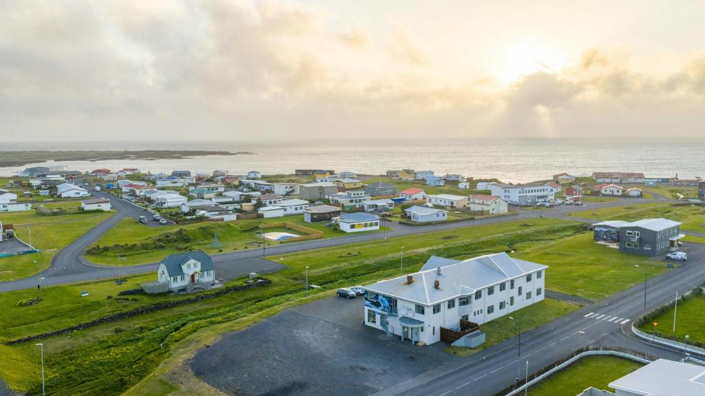 an aerial view of a small town next to the ocean at Adventure Hotel Hellissandur in Hellissandur