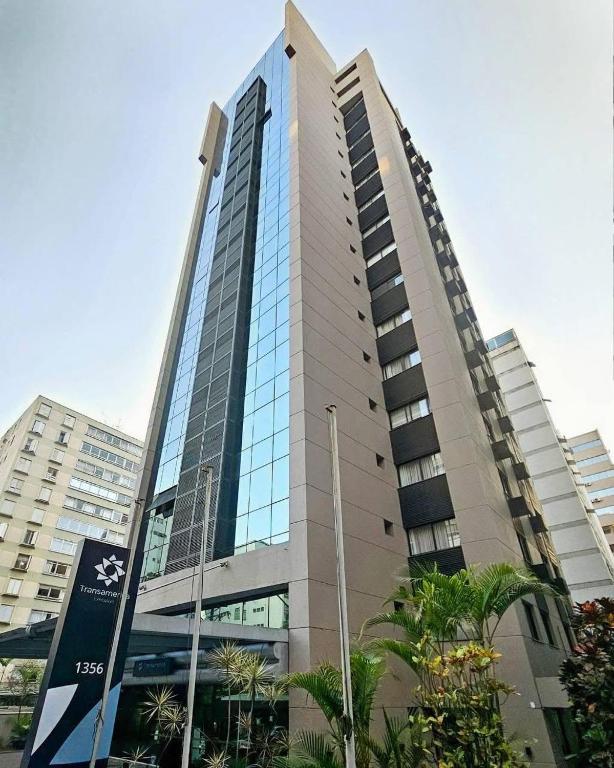 a tall building with trees in front of it at Transamerica Executive Bela Cintra (Paulista) in São Paulo