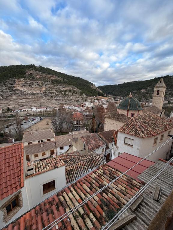 an aerial view of a town with roofs at Mirador de los Tejados in Alcalá del Júcar