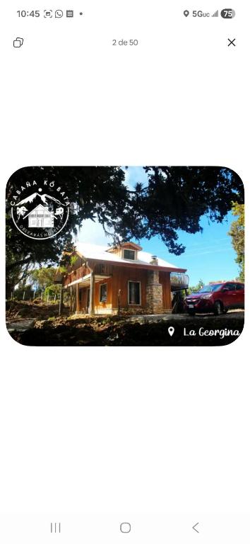 a picture of a house with a car in front of it at Cabaña kobata in Villa Mills