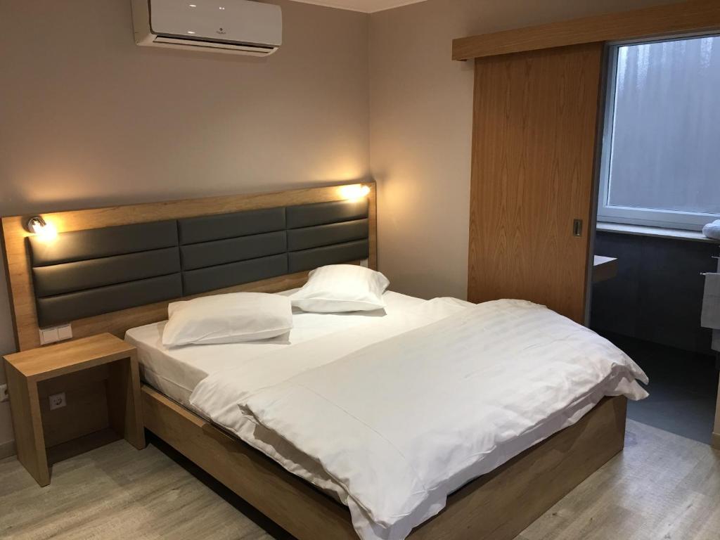 Postel nebo postele na pokoji v ubytování Auberge La Veranda