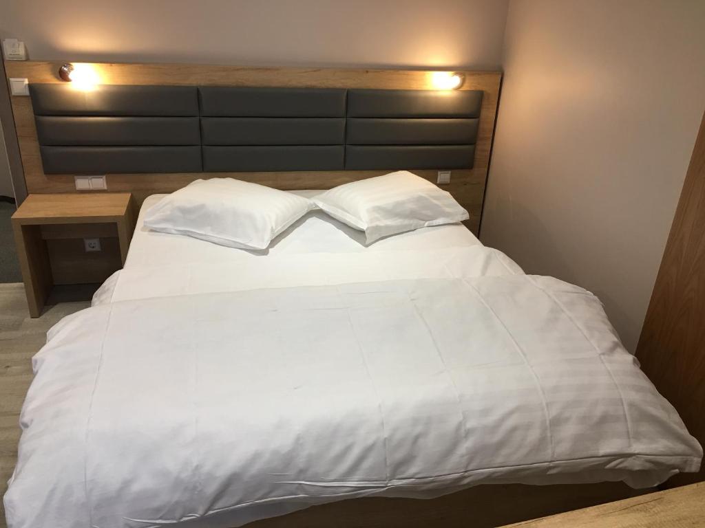 Postel nebo postele na pokoji v ubytování Auberge La Veranda