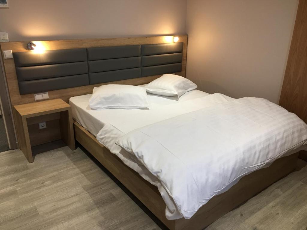 Postel nebo postele na pokoji v ubytování Auberge La Veranda
