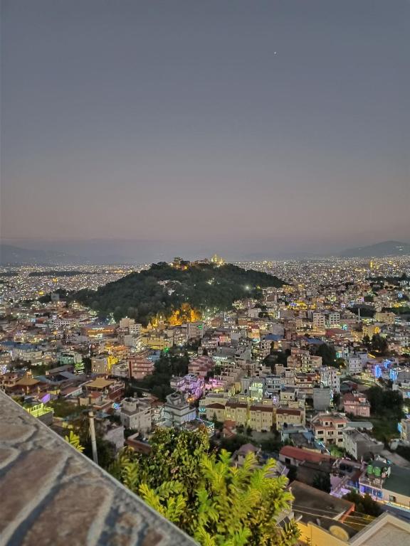 a view of a city from the top of a building at Kiyo's Apartment in Bālāju